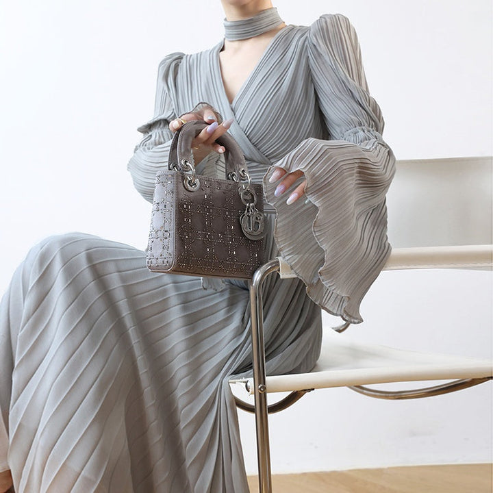 ホルターネックベルスリーブプリーツドレス